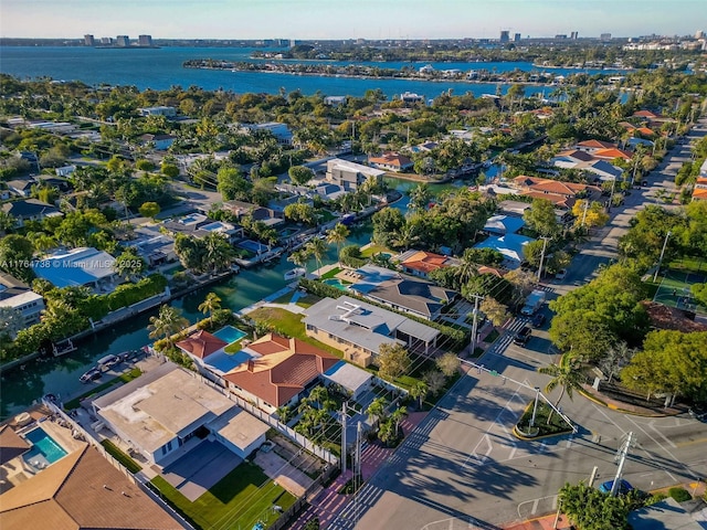 aerial perspective of suburban area with a nearby body of water