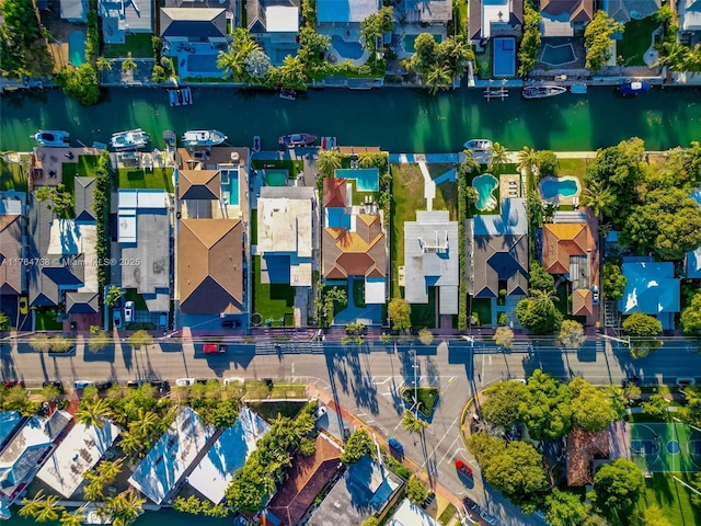 aerial view of residential area with a nearby body of water
