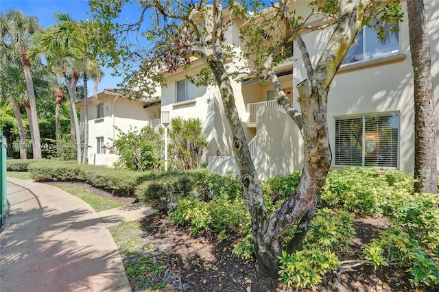 view of side of property with stucco siding