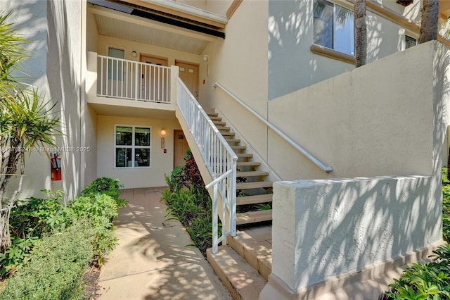 view of exterior entry with stucco siding