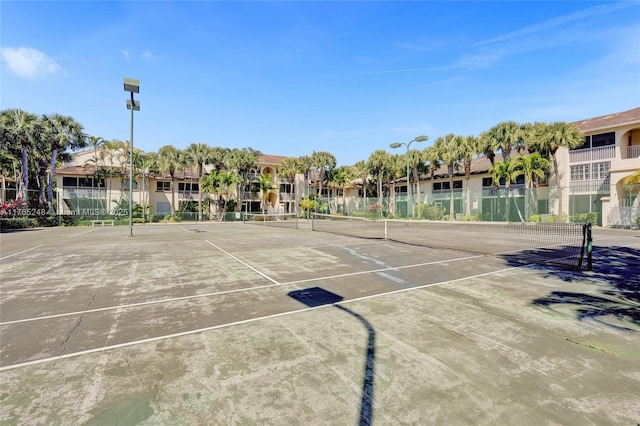 view of sport court featuring fence