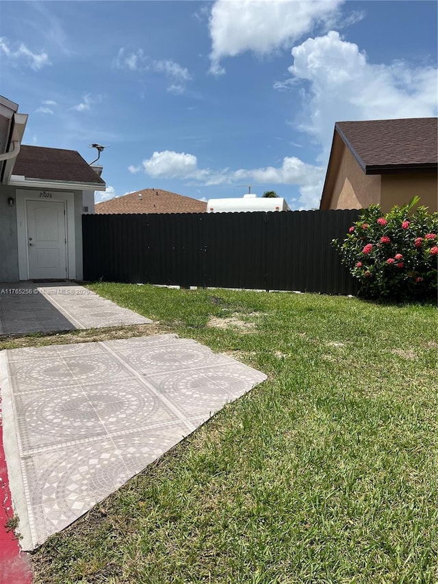 view of yard with a patio area and fence