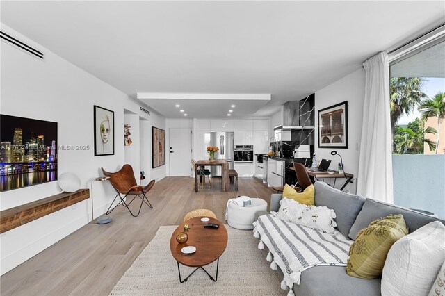 4000 NE 170th St Unit 300, North Miami Beach, FL 33160 - living room featuring light wood-type flooring and visible vents