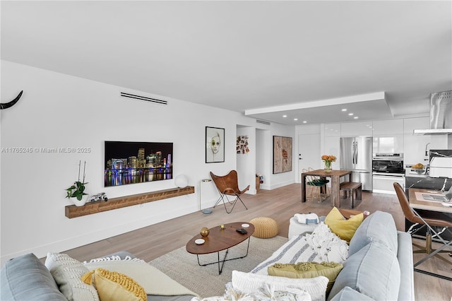 4000 NE 170th St Unit 300, North Miami Beach, FL 33160 - living room with visible vents, recessed lighting, baseboards, and wood finished floors