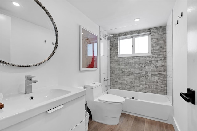 4000 NE 170th St Unit 300, North Miami Beach, FL 33160 - full bath featuring toilet, vanity, bathtub / shower combination, and wood finished floors