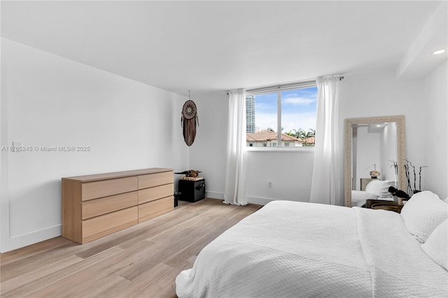 4000 NE 170th St Unit 300, North Miami Beach, FL 33160 - bedroom featuring light wood-type flooring and baseboards
