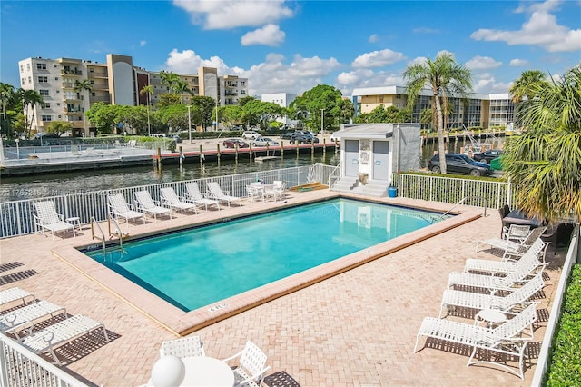 4000 NE 170th St Unit 300, North Miami Beach, FL 33160 - community pool featuring a patio area, a water view, and fence