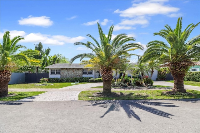 8340 SW 41st Ter, Miami, FL 33155 - view of front facade with fence, a front lawn, and curved driveway