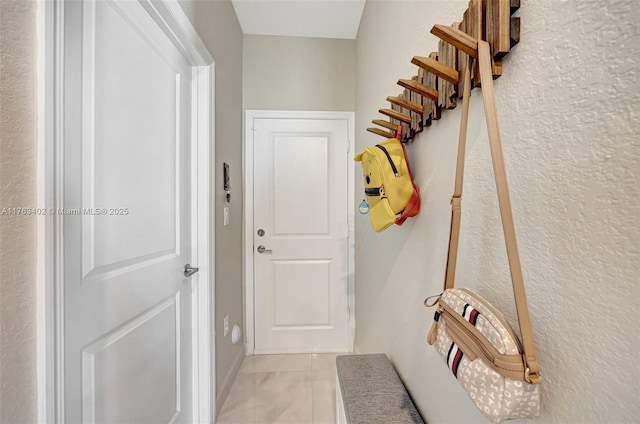 mudroom featuring light tile patterned floors