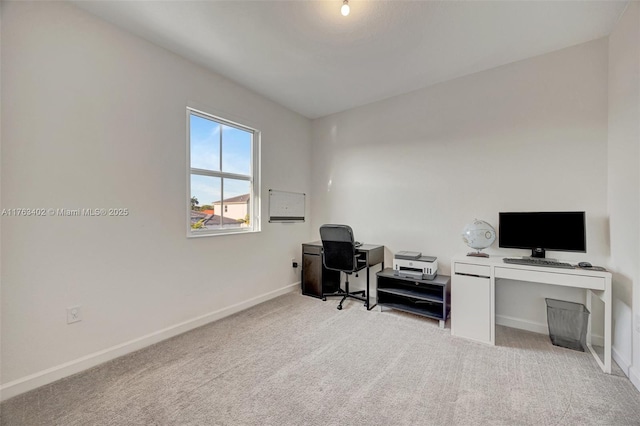 office featuring baseboards and carpet floors