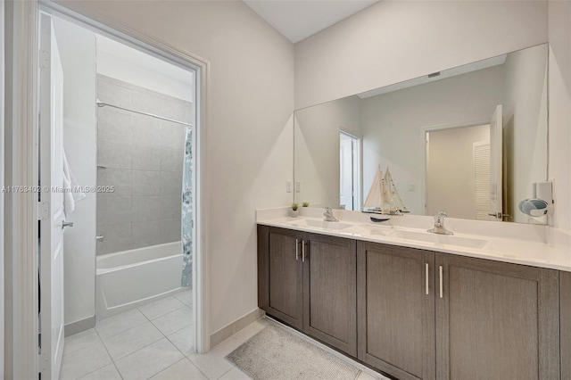full bathroom with tile patterned floors, shower / bath combination with curtain, double vanity, and a sink