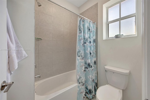 bathroom with toilet and shower / bath combo with shower curtain