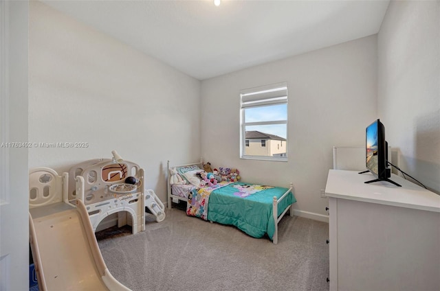 bedroom with baseboards and carpet floors