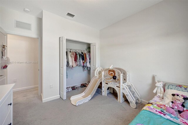 bedroom with visible vents, baseboards, and carpet floors