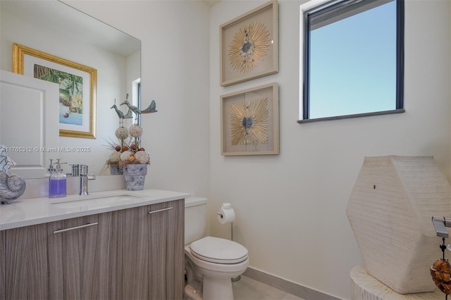 8321 Central Park Blvd, Doral, FL 33166 - bathroom with baseboards, toilet, and vanity