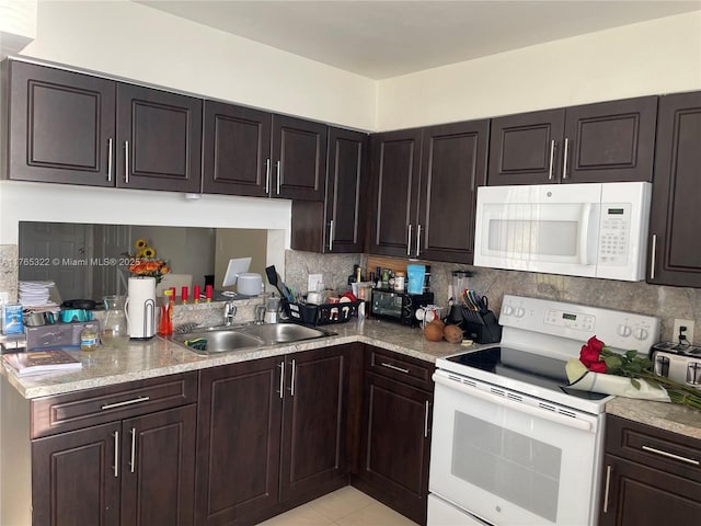 kitchen featuring white appliances, dark brown cabinets, backsplash, and a sink