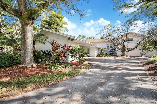 13575 SW 72nd Ave, Pinecrest, FL 33156 - view of front of property with driveway and stucco siding