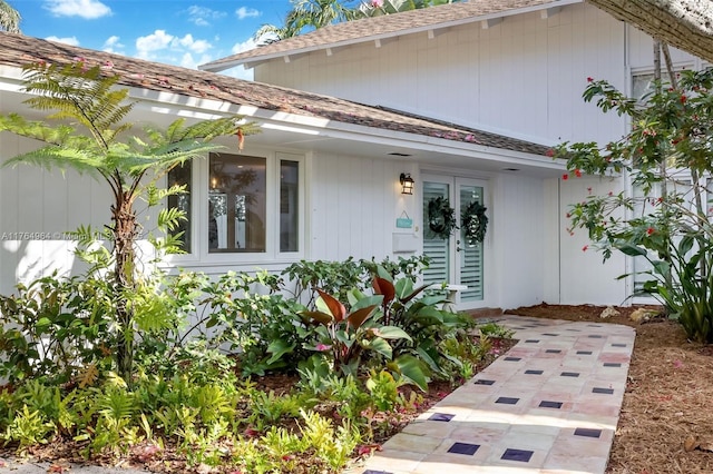 13575 SW 72nd Ave, Pinecrest, FL 33156 - doorway to property with a shingled roof and french doors