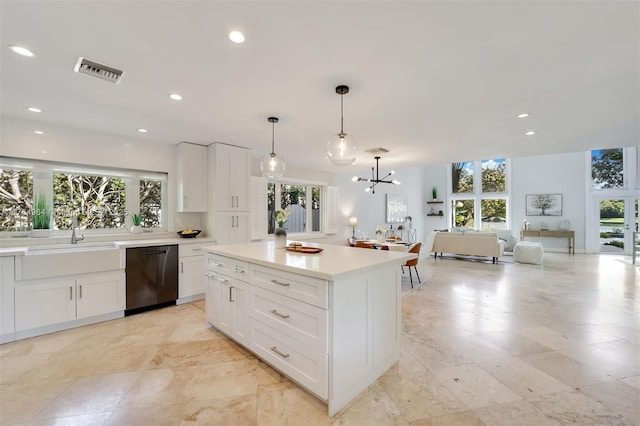 13575 SW 72nd Ave, Pinecrest, FL 33156 - kitchen with dishwasher, plenty of natural light, a chandelier, white cabinets, and recessed lighting