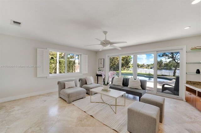 13575 SW 72nd Ave, Pinecrest, FL 33156 - living room featuring a water view, a ceiling fan, and recessed lighting
