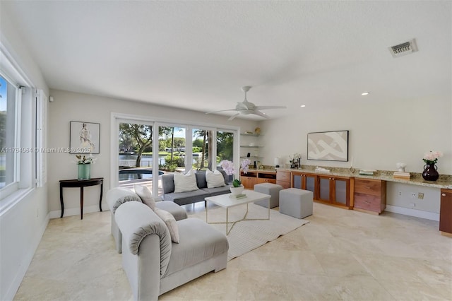 13575 SW 72nd Ave, Pinecrest, FL 33156 - living area with ceiling fan and a water view