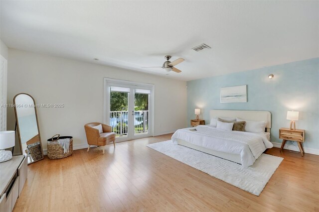 13575 SW 72nd Ave, Pinecrest, FL 33156 - bedroom featuring access to outside, light wood finished floors, and ceiling fan