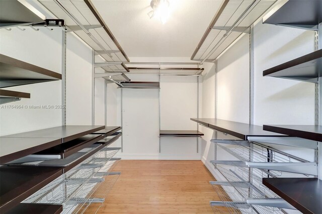 13575 SW 72nd Ave, Pinecrest, FL 33156 - spacious closet featuring light wood-style floors