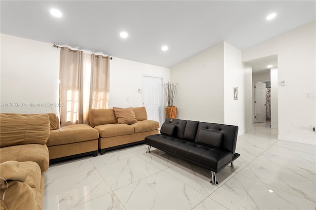 living area featuring lofted ceiling, recessed lighting, and marble finish floor
