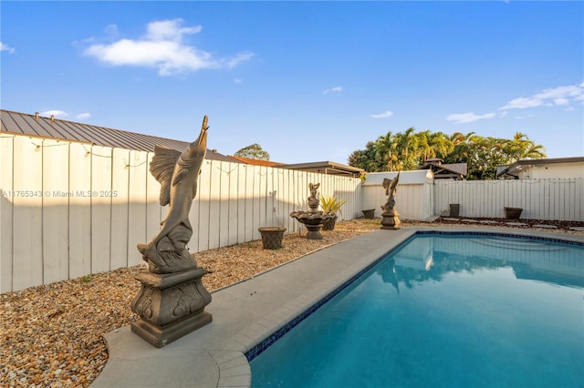 view of pool featuring a fenced in pool and a fenced backyard