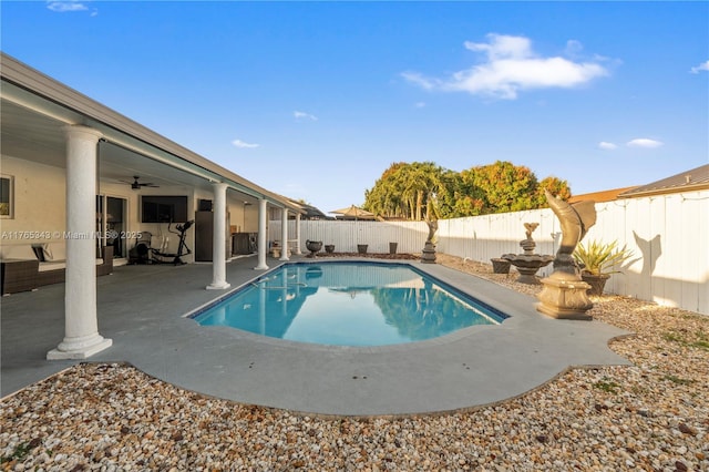 view of pool featuring a fenced backyard, a ceiling fan, a patio, and a fenced in pool