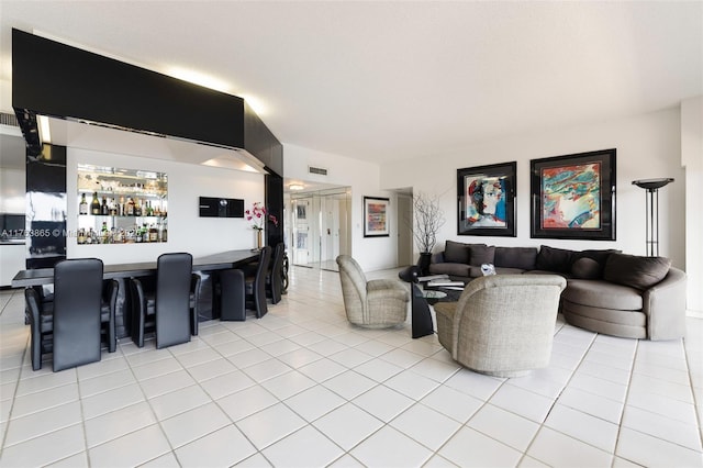 1800 NE 114th St Unit Ph06, Miami, FL 33181 - living room with light tile patterned floors, visible vents, and a dry bar