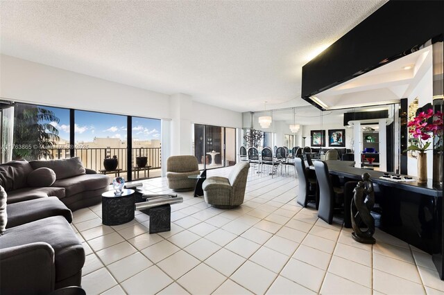 1800 NE 114th St Unit Ph06, Miami, FL 33181 - living room featuring light tile patterned flooring and a textured ceiling