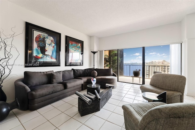 1800 NE 114th St Unit Ph06, Miami, FL 33181 - living area with light tile patterned flooring and a textured ceiling