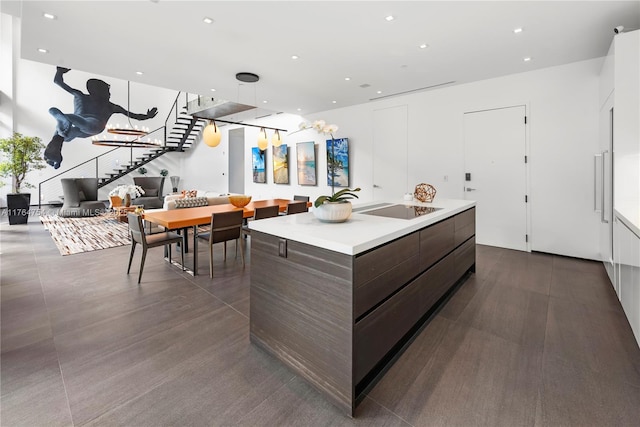 kitchen featuring light countertops, recessed lighting, and modern cabinets