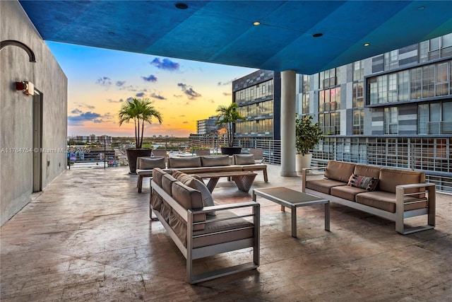 patio terrace at dusk with an outdoor living space
