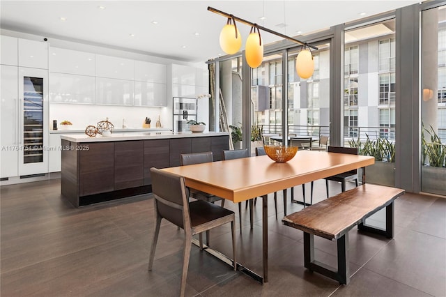 dining room with recessed lighting and expansive windows