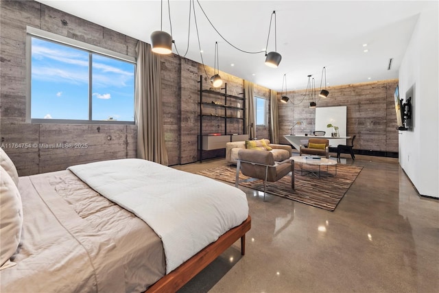 bedroom featuring finished concrete flooring