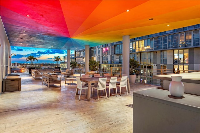 patio terrace at dusk with an outdoor hangout area