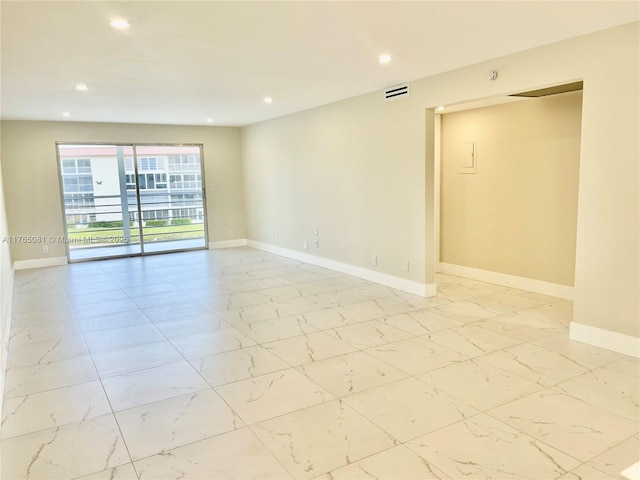 3005 Portofino Isle Unit F3, Coconut Creek, FL 33066 - empty room featuring light marble finish flooring, recessed lighting, and baseboards