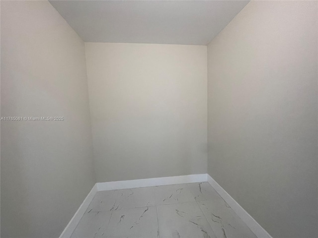 3005 Portofino Isle Unit F3, Coconut Creek, FL 33066 - unfurnished room with baseboards and marble finish floors
