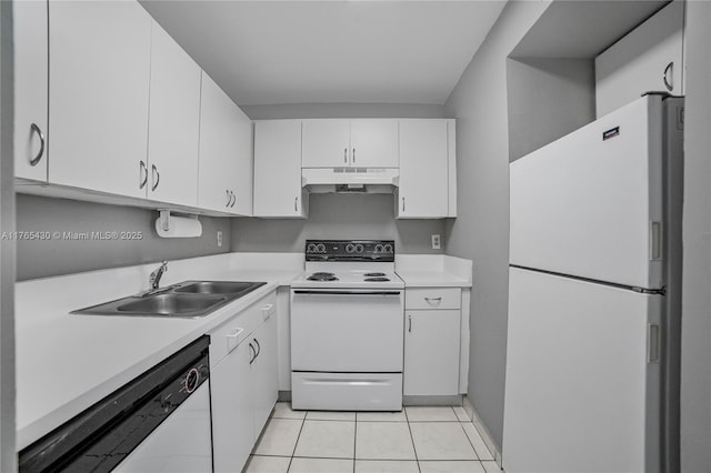 kitchen featuring white appliances, a sink, light countertops, white cabinets, and under cabinet range hood