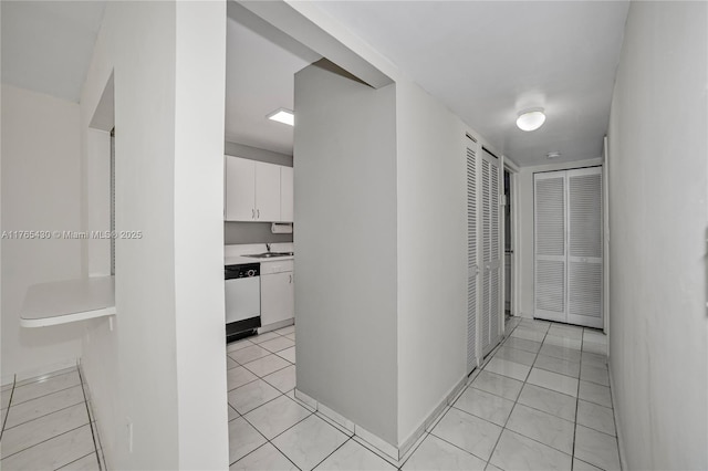 hallway with light tile patterned floors