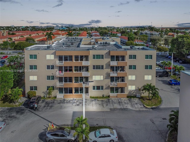 view of property with uncovered parking