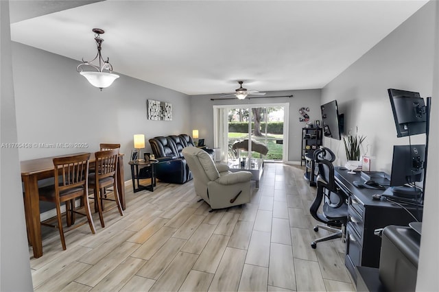 office area featuring wood finish floors, baseboards, and ceiling fan