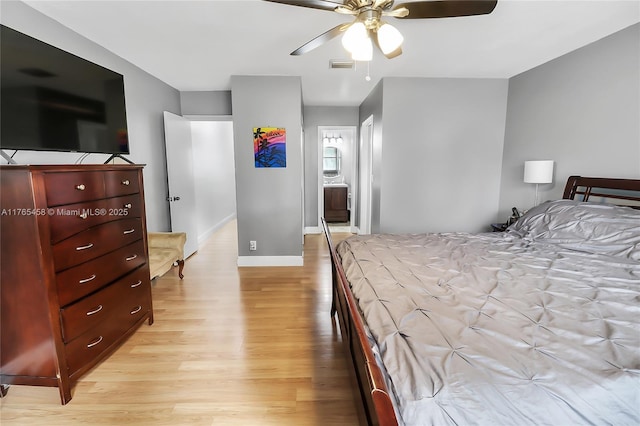 bedroom with visible vents, baseboards, light wood-style floors, and a ceiling fan