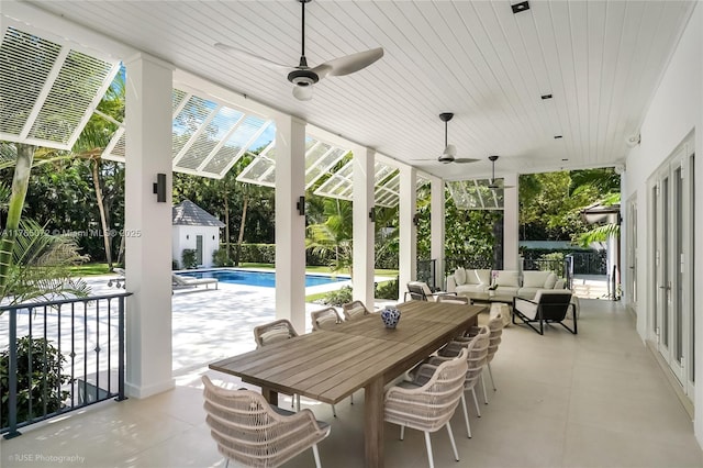 4550 Sunset Dr, Coral Gables, FL 33143 - view of patio with an outdoor hangout area, ceiling fan, and outdoor dining area