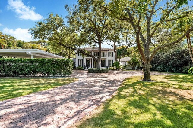4550 Sunset Dr, Coral Gables, FL 33143 - colonial home with a front lawn and decorative driveway