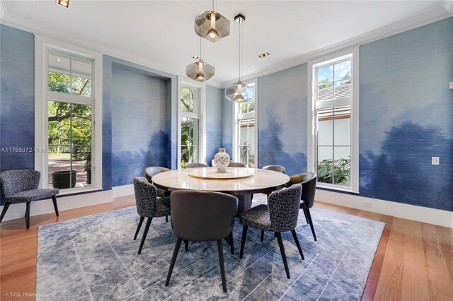4550 Sunset Dr, Coral Gables, FL 33143 - dining area with crown molding, wood finished floors, healthy amount of natural light, and baseboards
