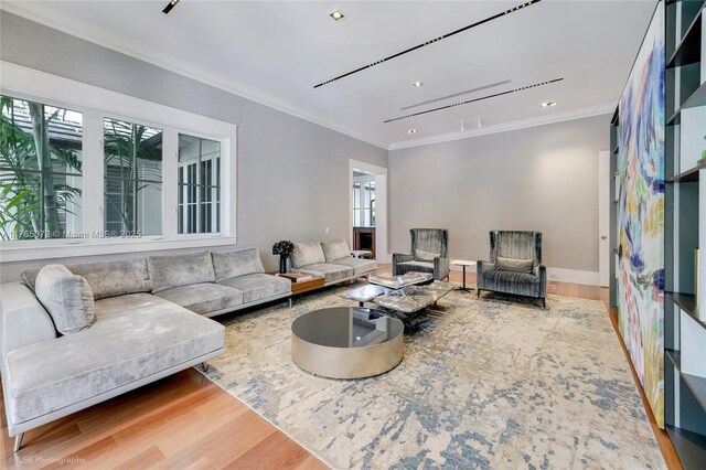 4550 Sunset Dr, Coral Gables, FL 33143 - living room featuring wood finished floors, ornamental molding, baseboards, and recessed lighting