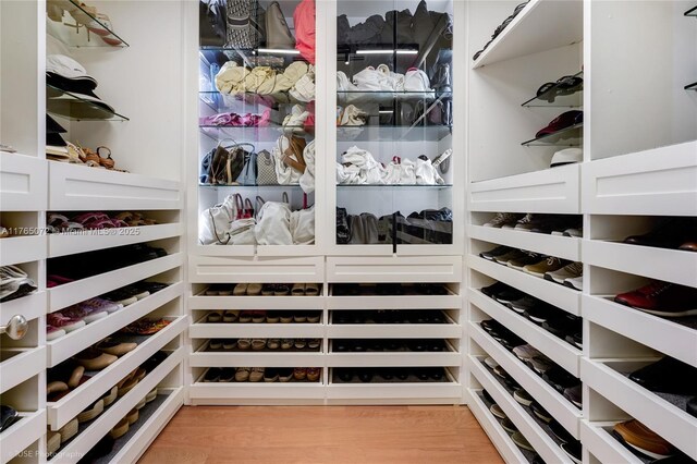 4550 Sunset Dr, Coral Gables, FL 33143 - walk in closet featuring light wood-style floors